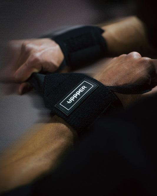 man putting on uppper wrist wraps