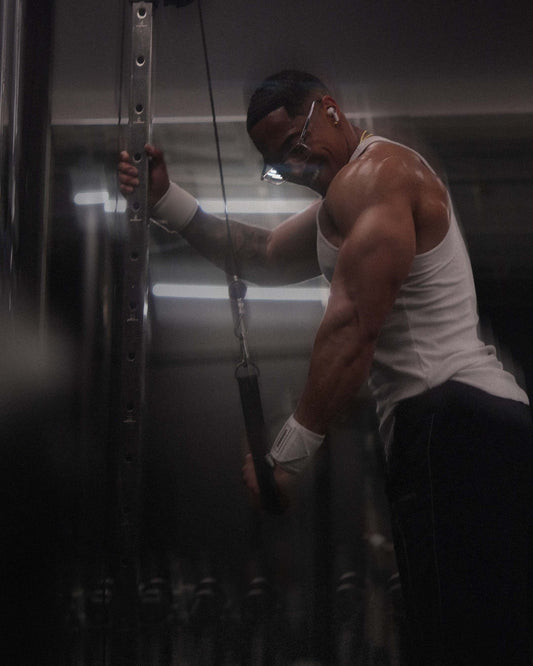man doing unilateral exercise wearing uppper wrist wraps