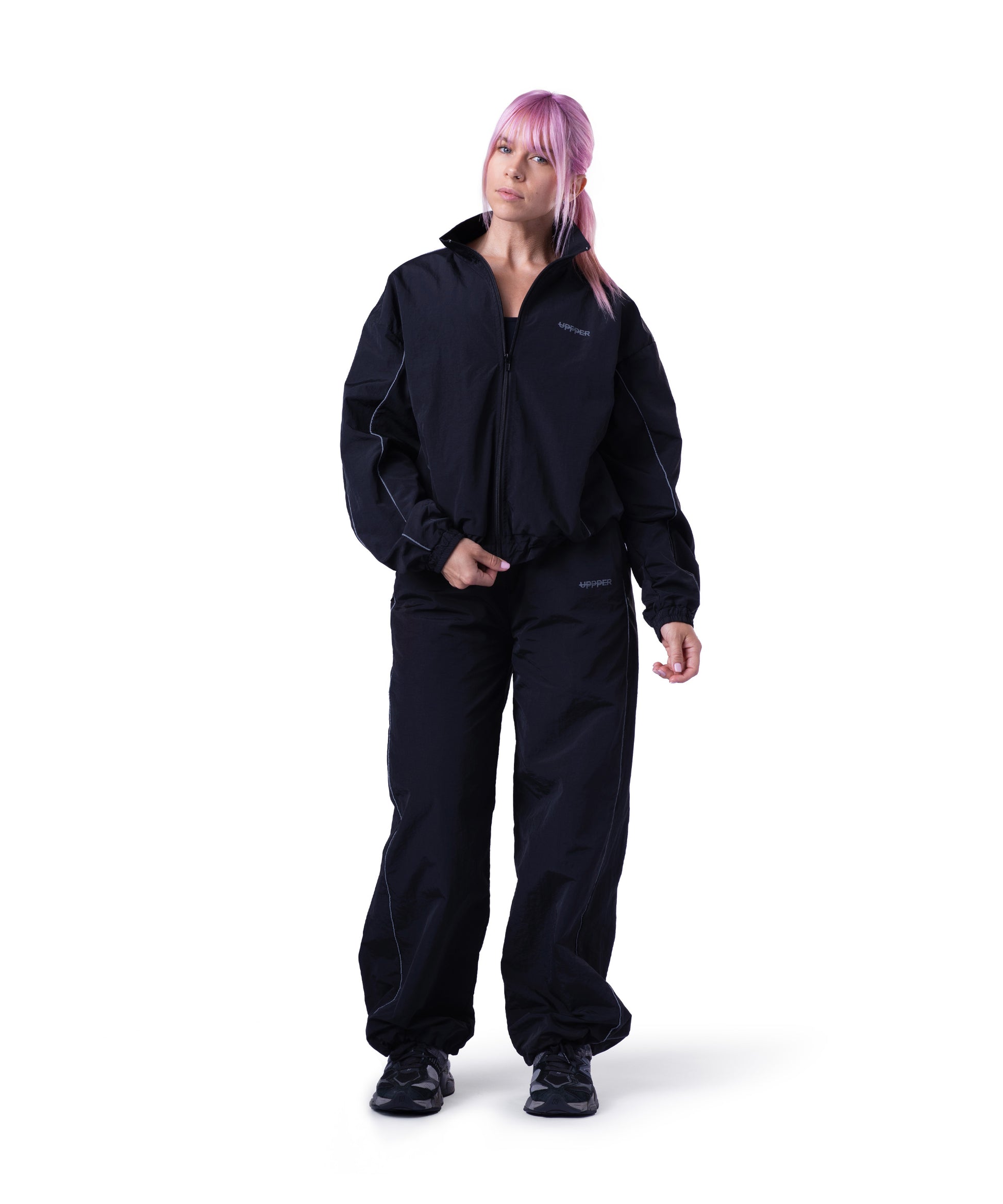 model wearing black uppper track jacket lifestyle shot