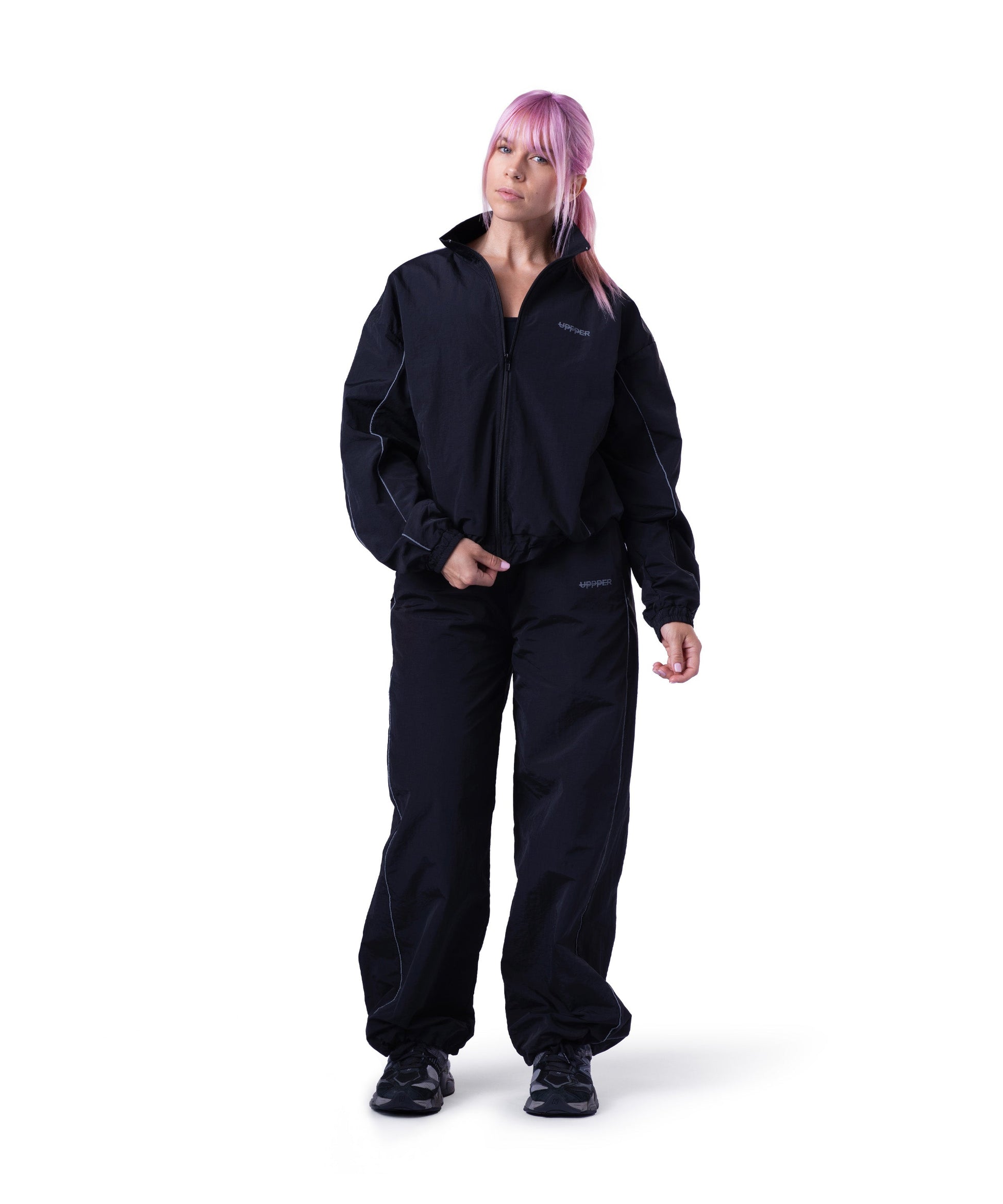 model wearing black uppper track pants lifestyle shot