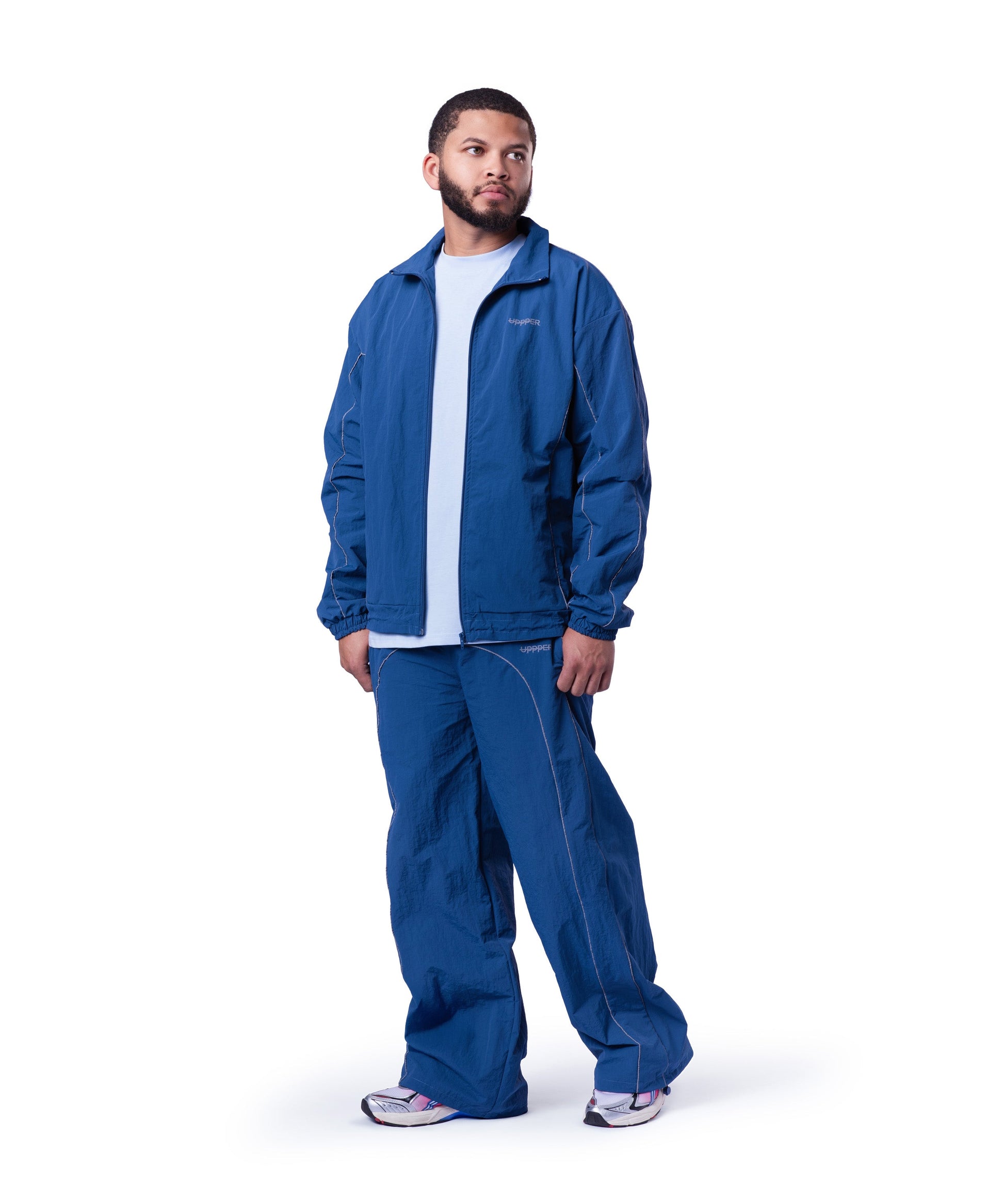 model wearing blue uppper track pants lifestyle shot