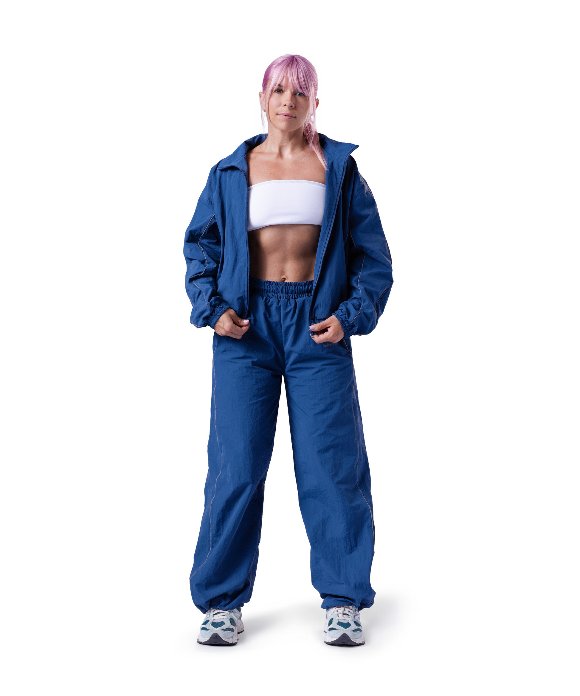 model wearing blue uppper track jacket lifestyle shot