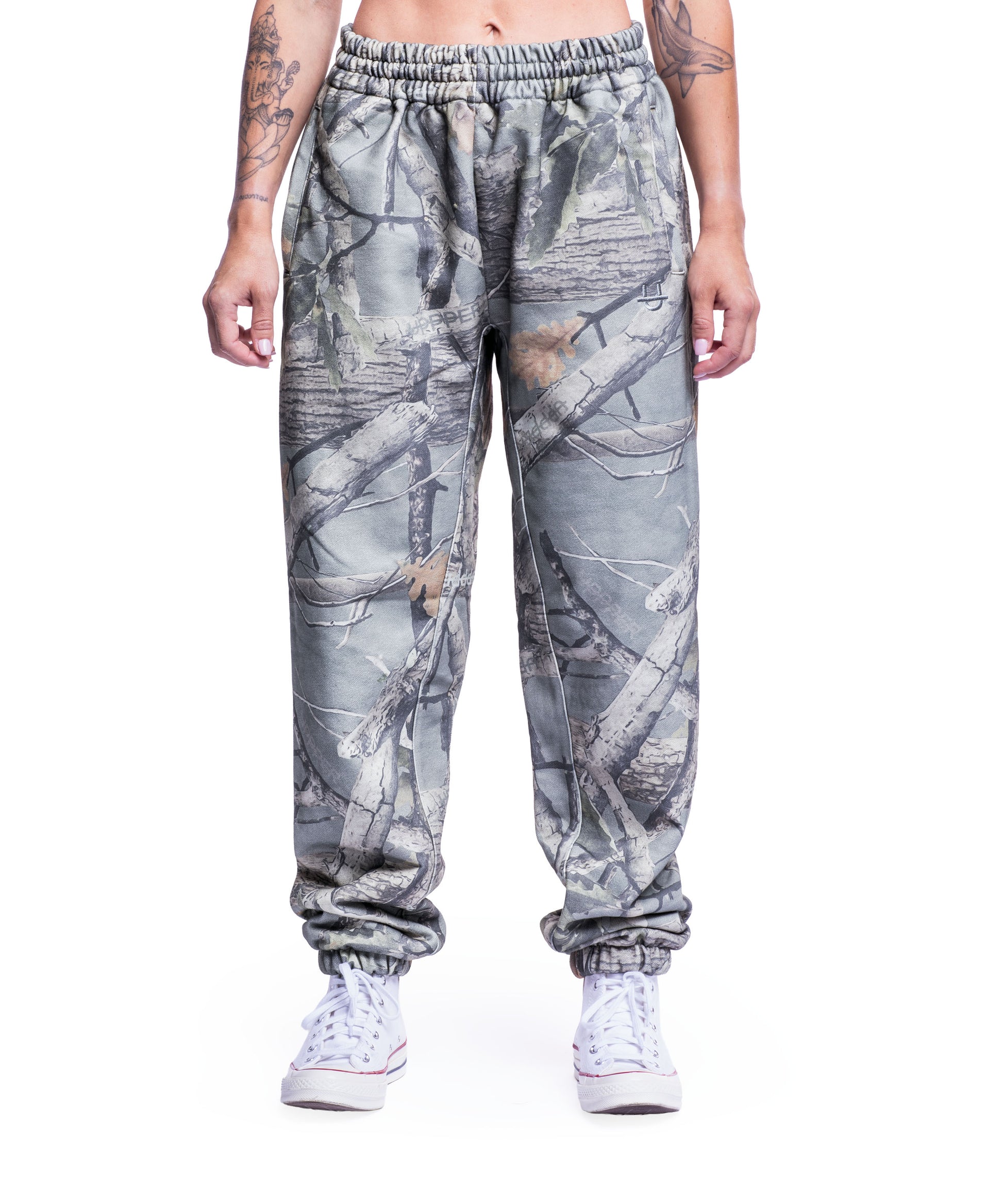 model wearing camo uppper sweatpants mens showing full leg from waist down on white background