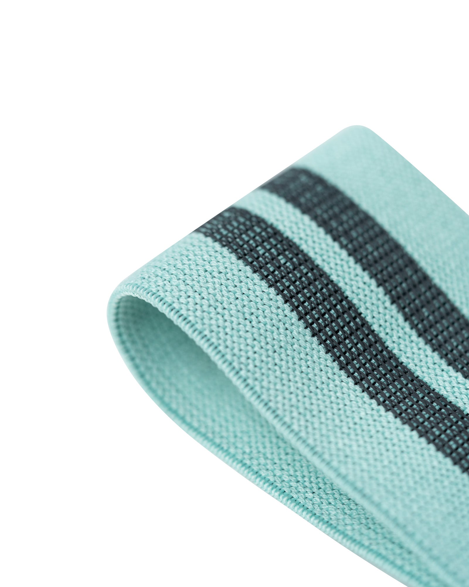 tan uppper resistance band worn around thighs during glute exercise