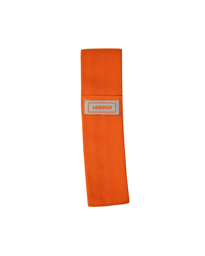 orange uppper fabric hip resistance band laid flat on white background