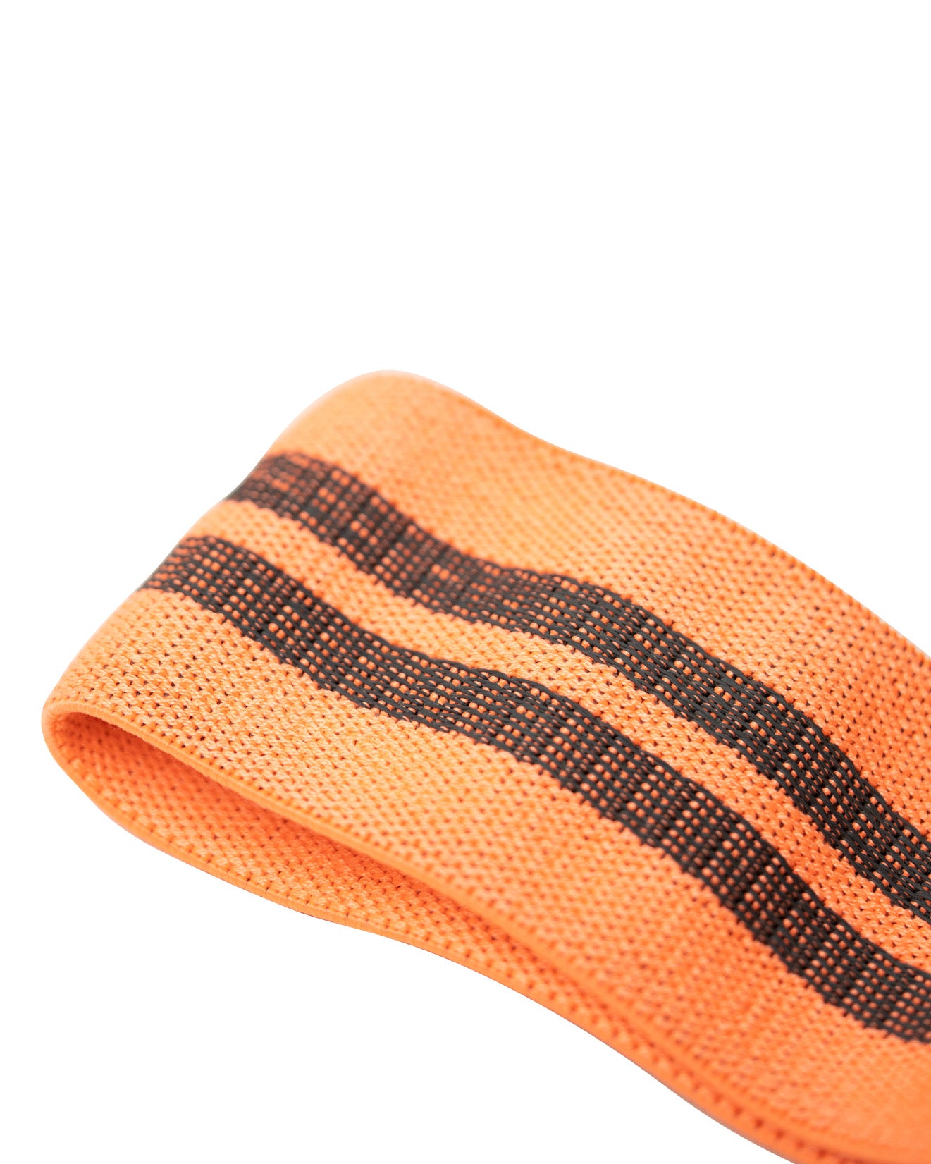peach uppper resistance band worn around thighs during glute exercise