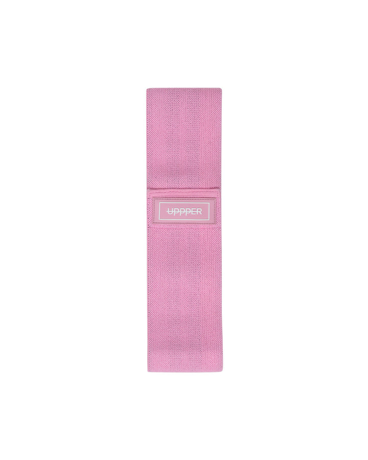 tan uppper fabric hip resistance band laid flat on white background