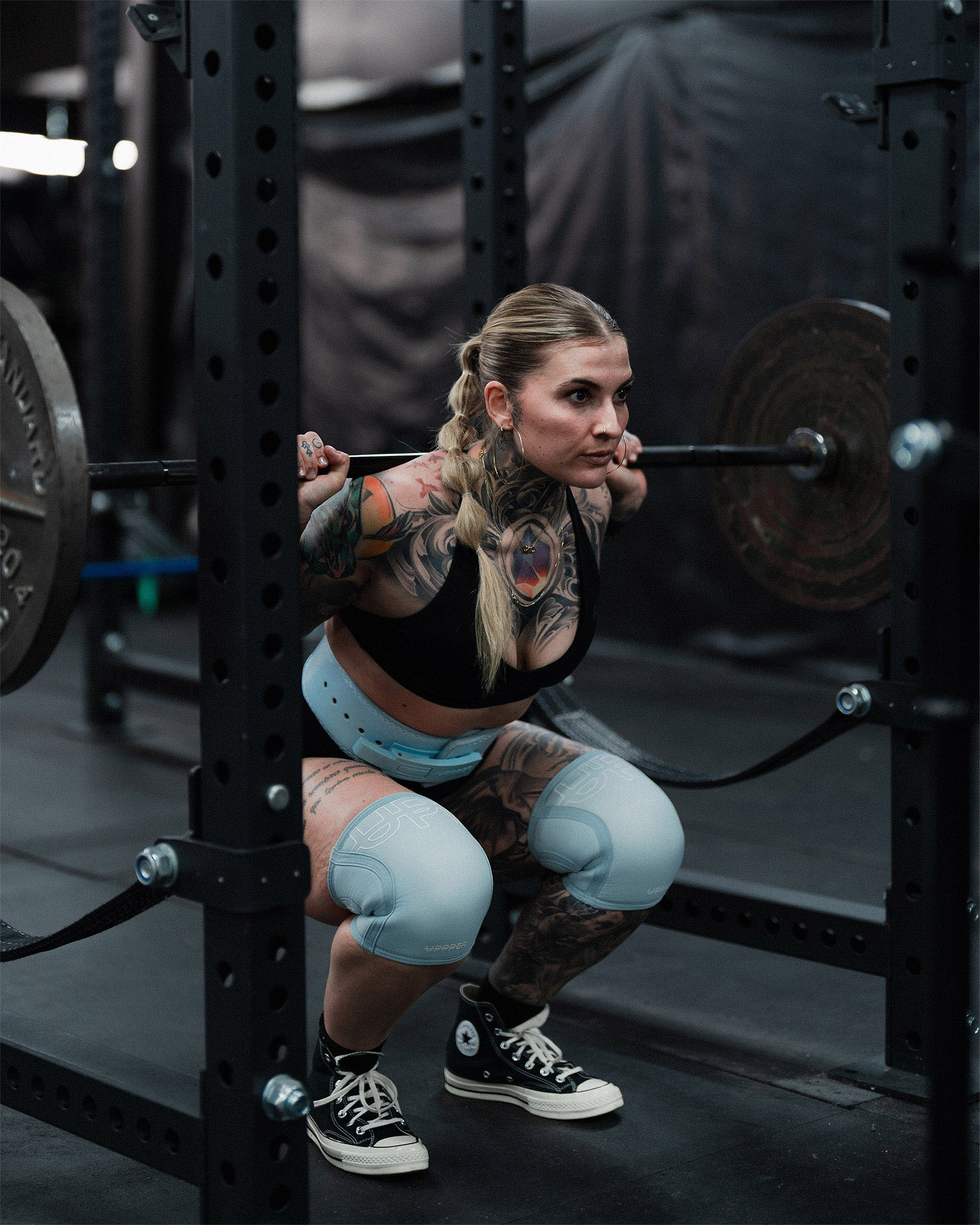 baby blue uppper knee sleeves worn on knees during training
