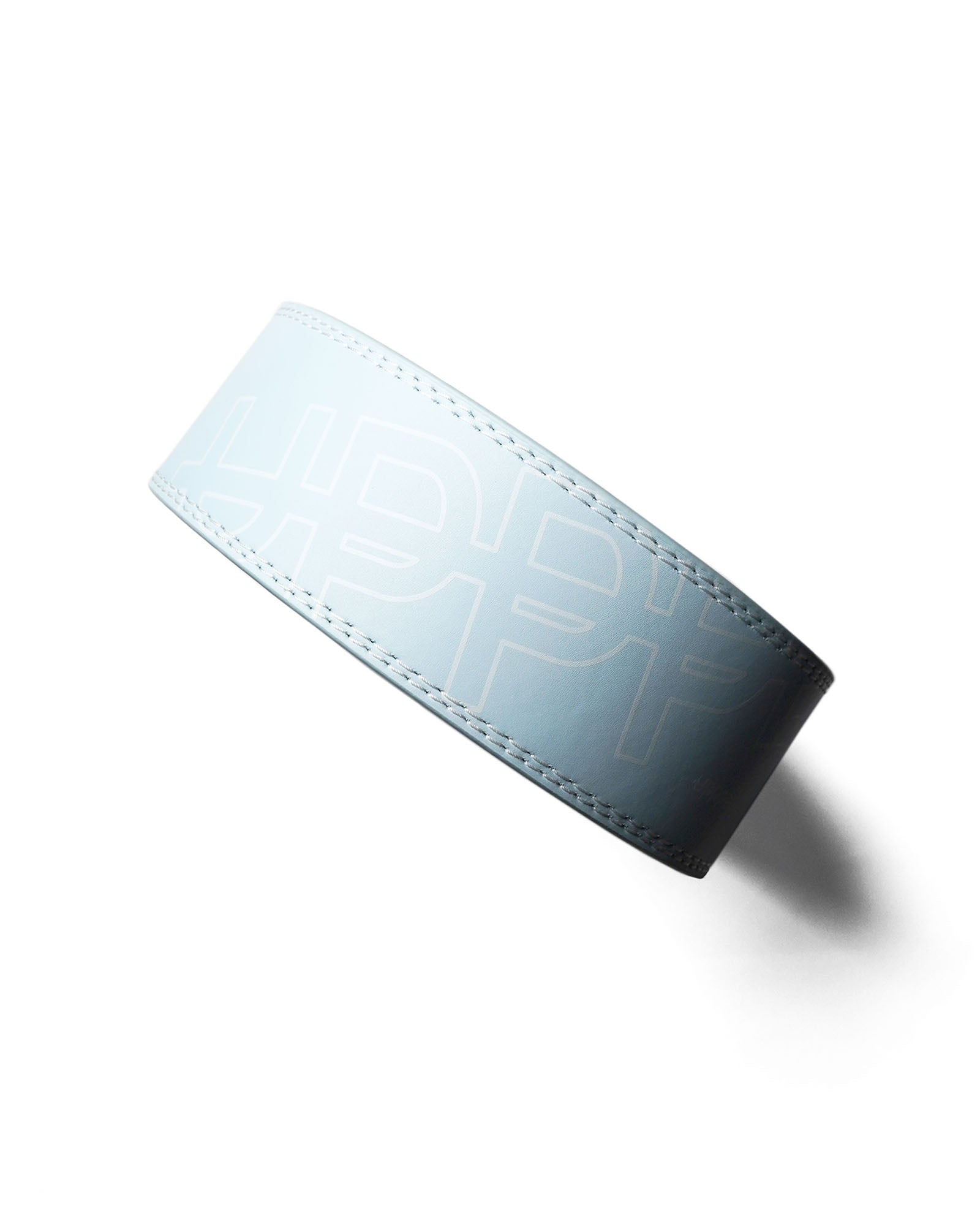 baby blue uppper leather lever belt flat lay showing stitching detail and lever buckle