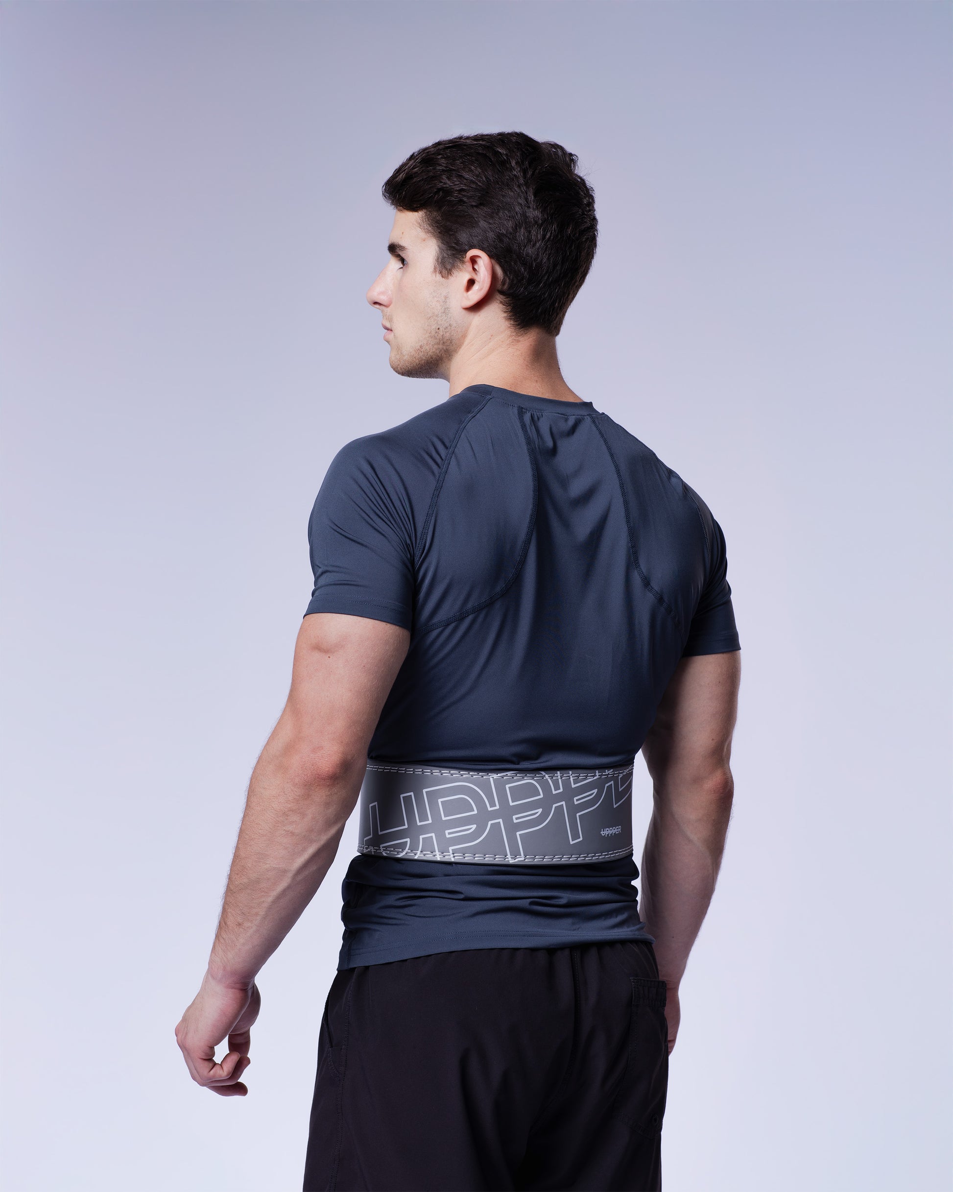 athlete showing grey uppper lever belt studio shot