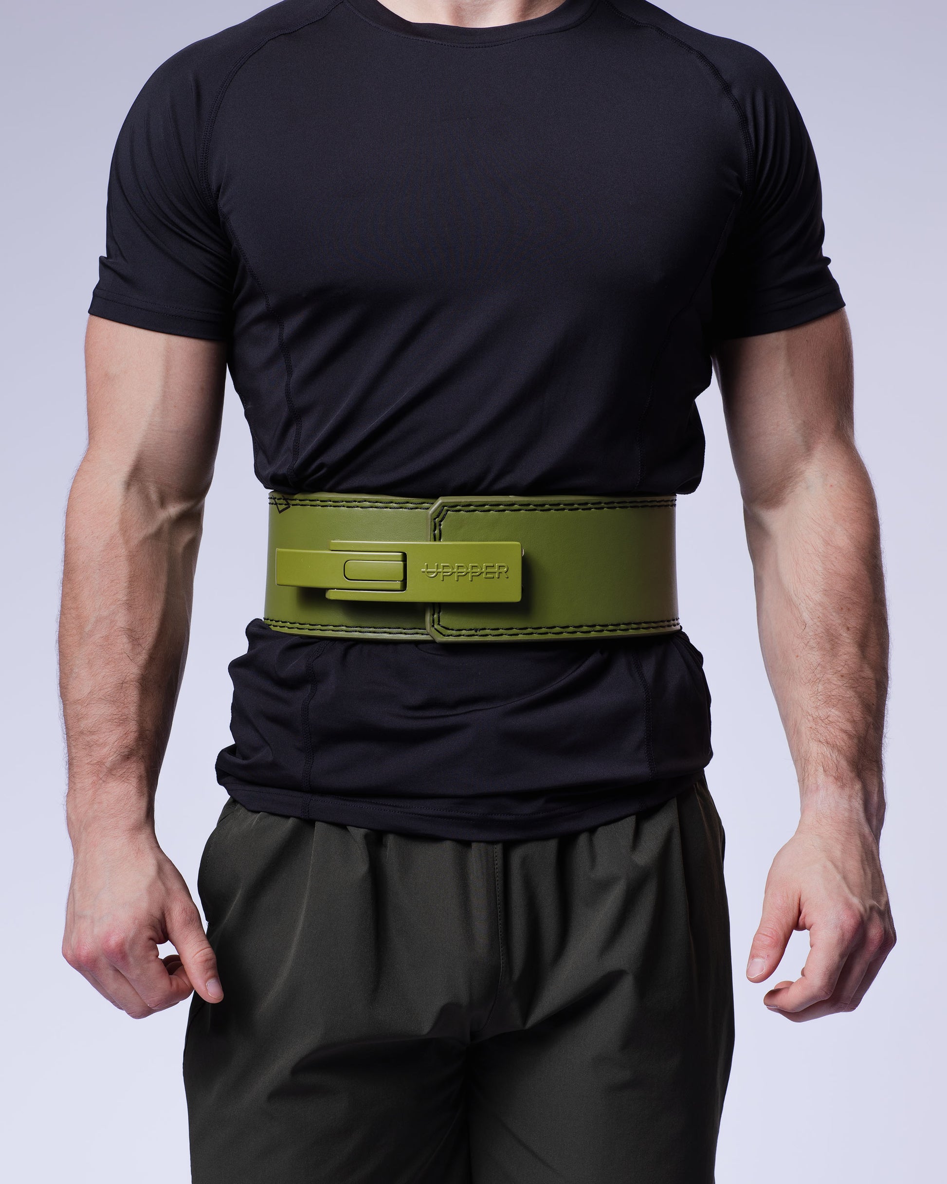 man wearing khaki uppper lever belt close-up showing buckle