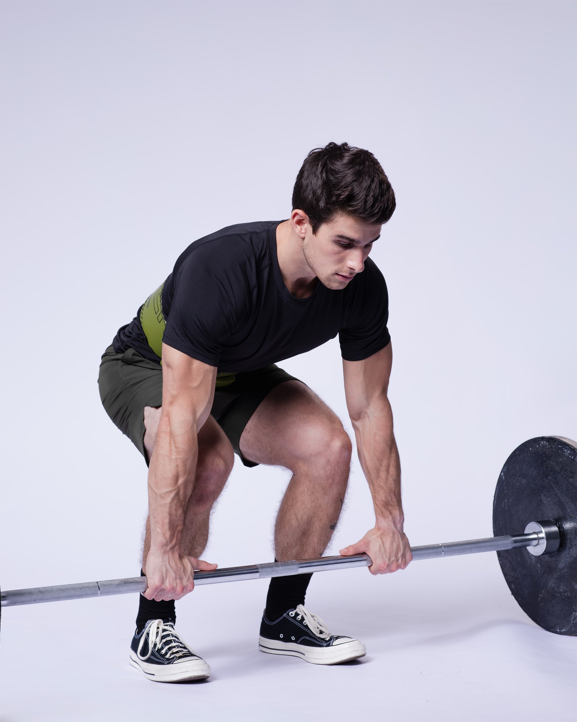 athlete performing exercise khaki uppper lever belt