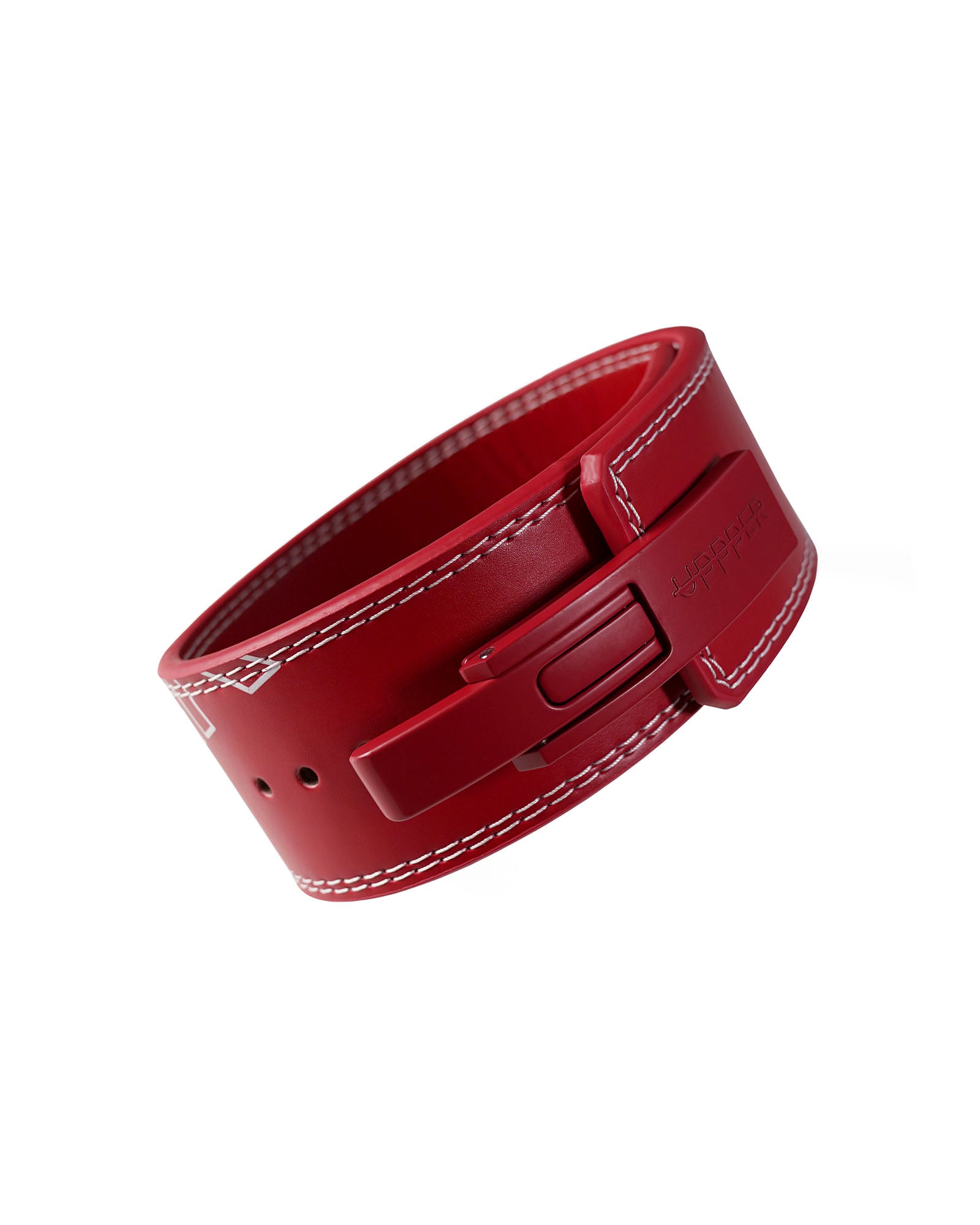 red uppper leather lever belt coiled showing lever buckle mechanism on white background