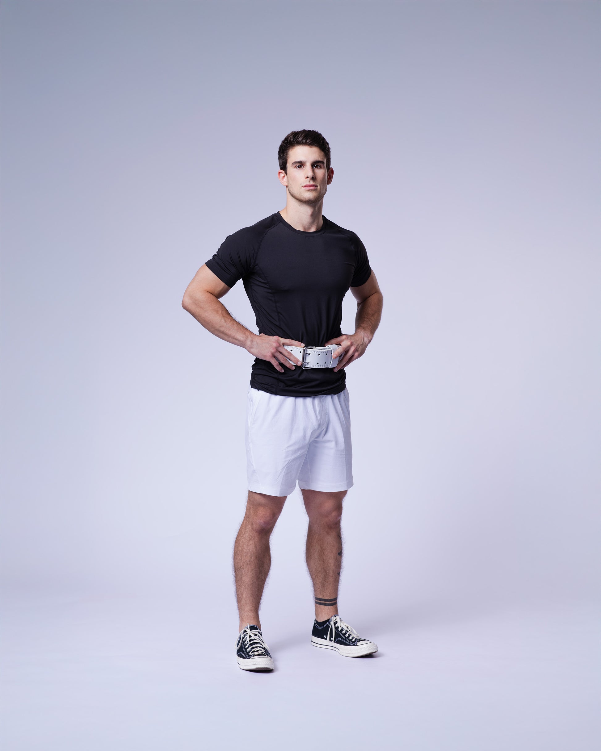 athlete wearing white uppper lifting belt
