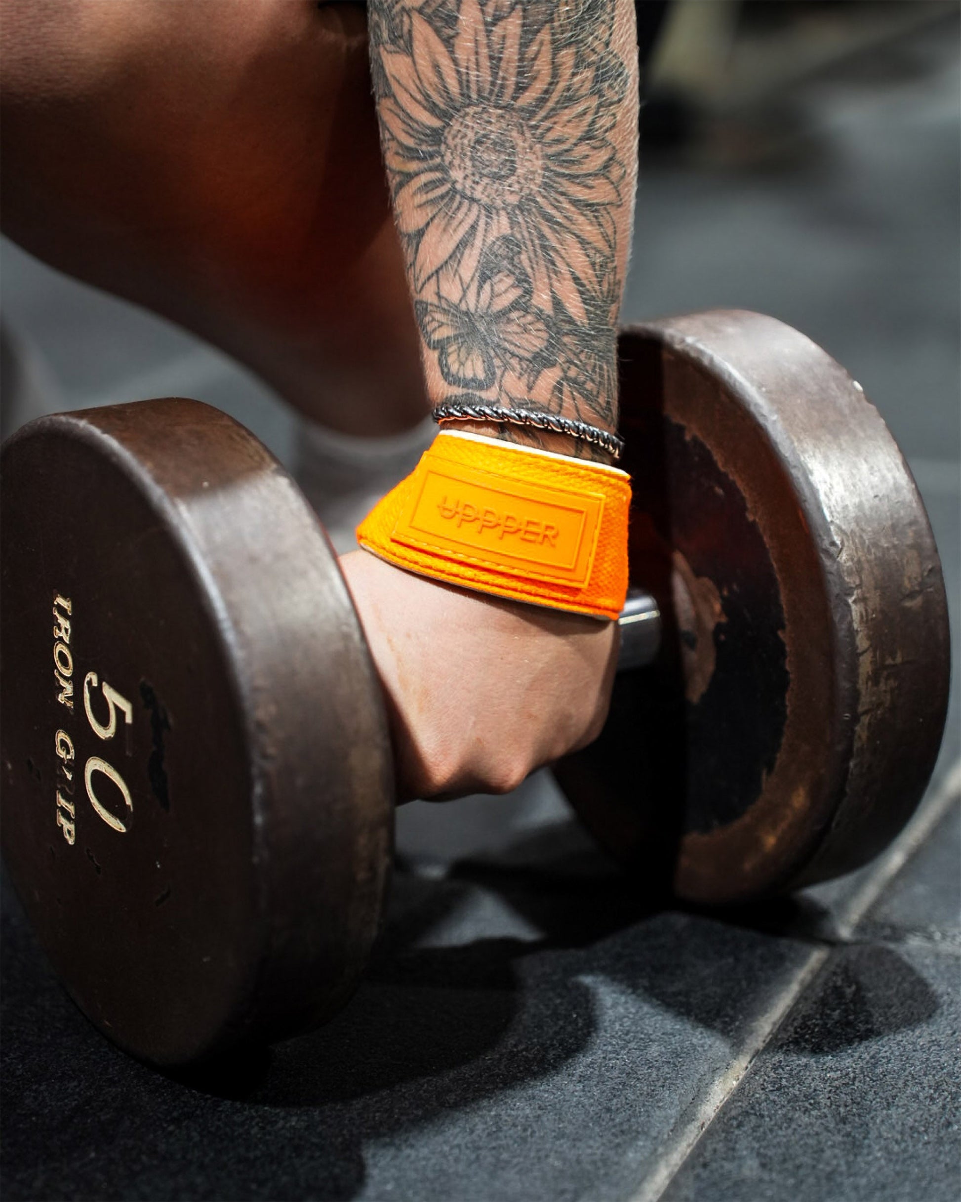 neon orange uppper lifting straps in action