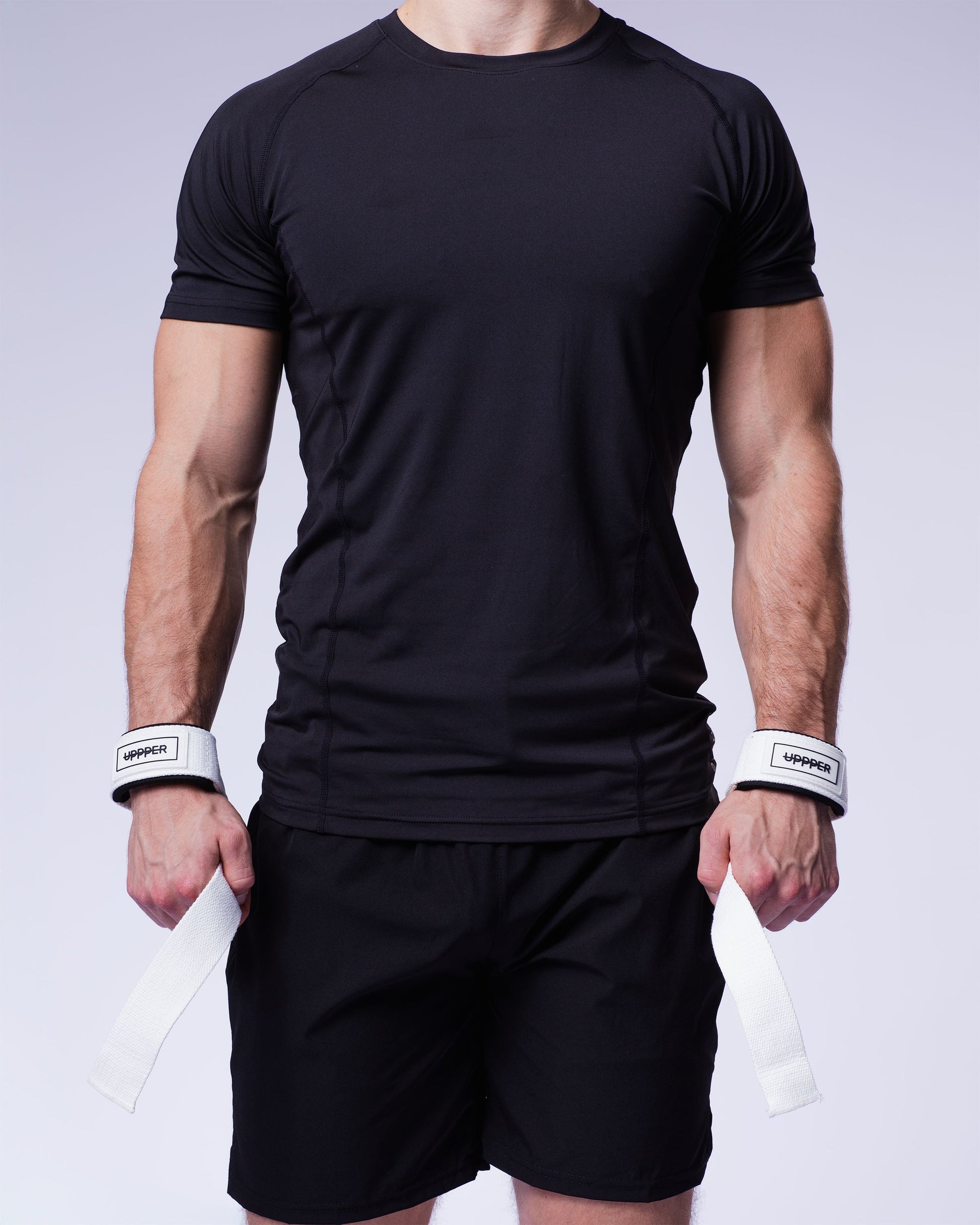 athlete in white uppper lifting straps on white background 