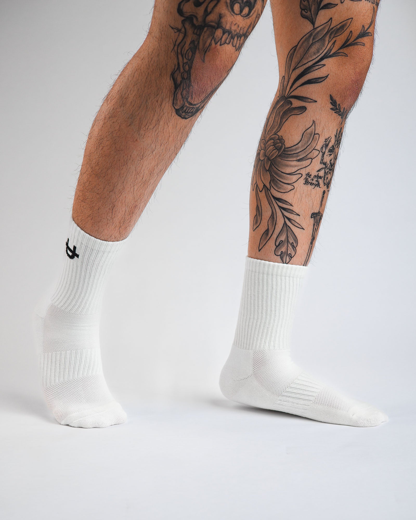 off-white uppper crew socks worn on feet showing fit and logo detail