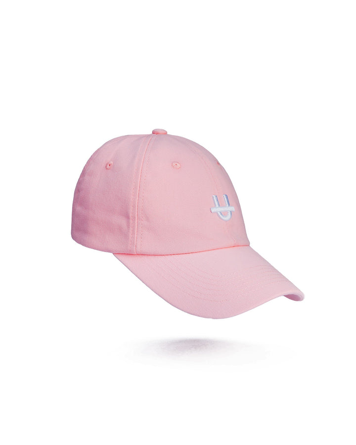 pink uppper dad cap with embroidered u logo on front panel side view on white background