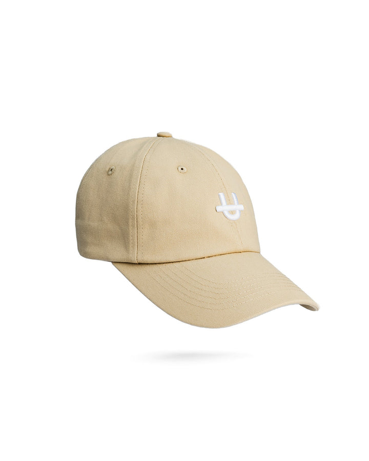 sail uppper dad cap with embroidered u logo on front panel side view on white background