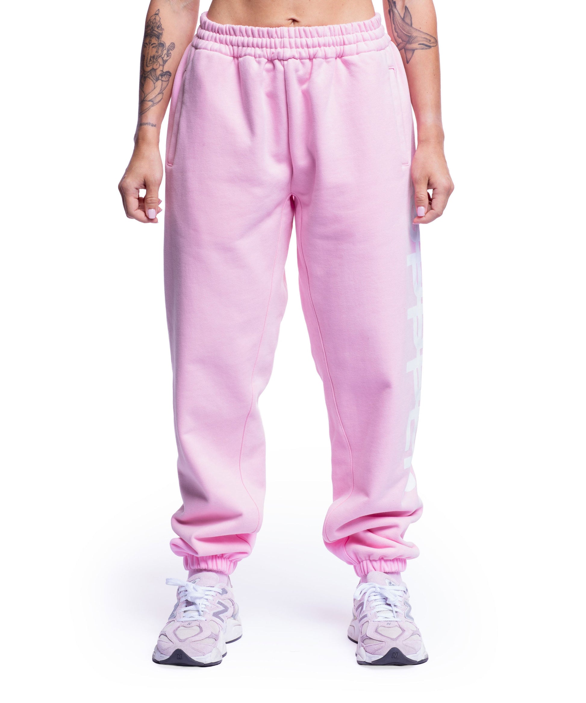model wearing pink uppper sweatpants womens showing full leg from waist down on white background