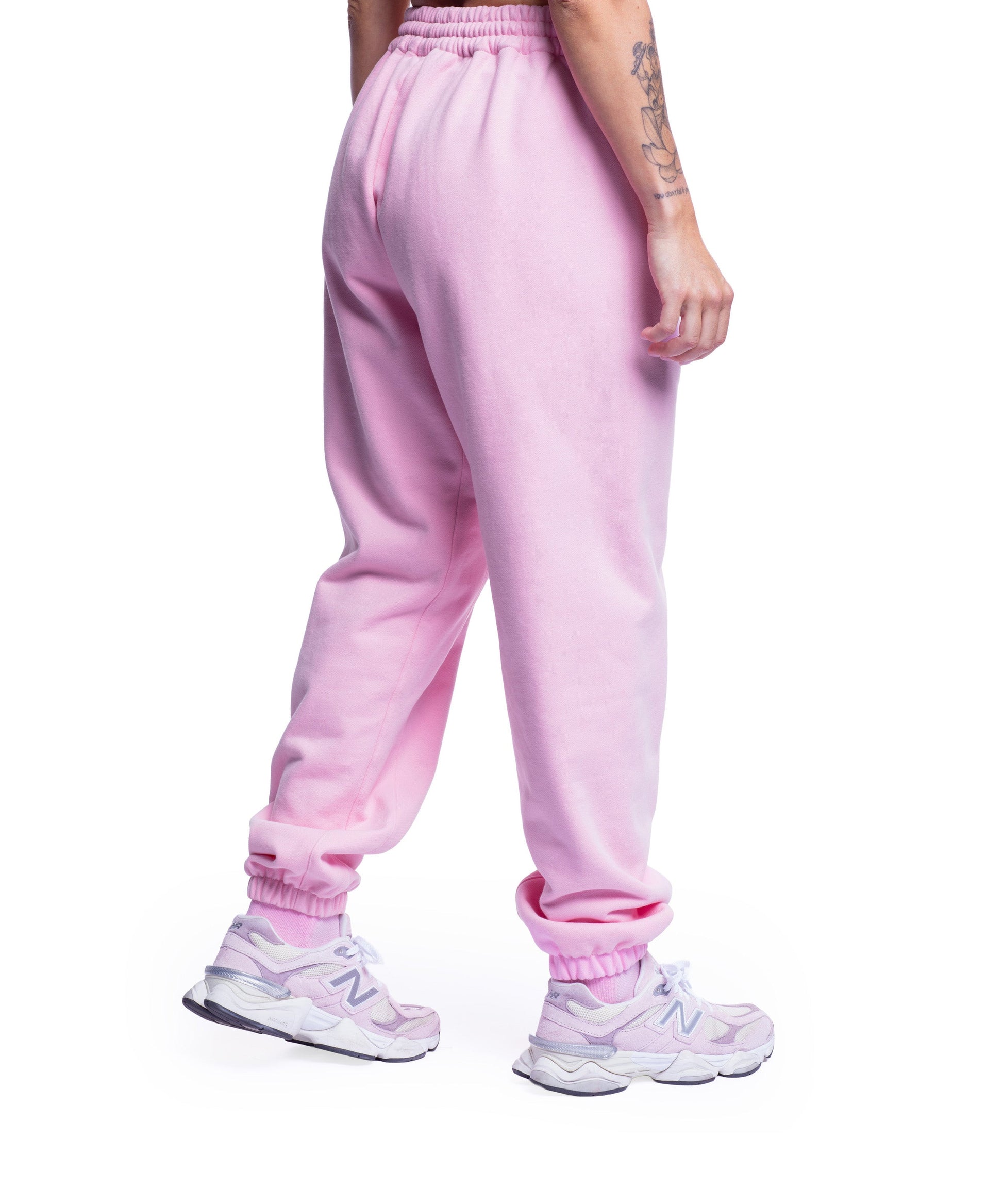 close-up of pink uppper sweatpants showing waistband and logo detail