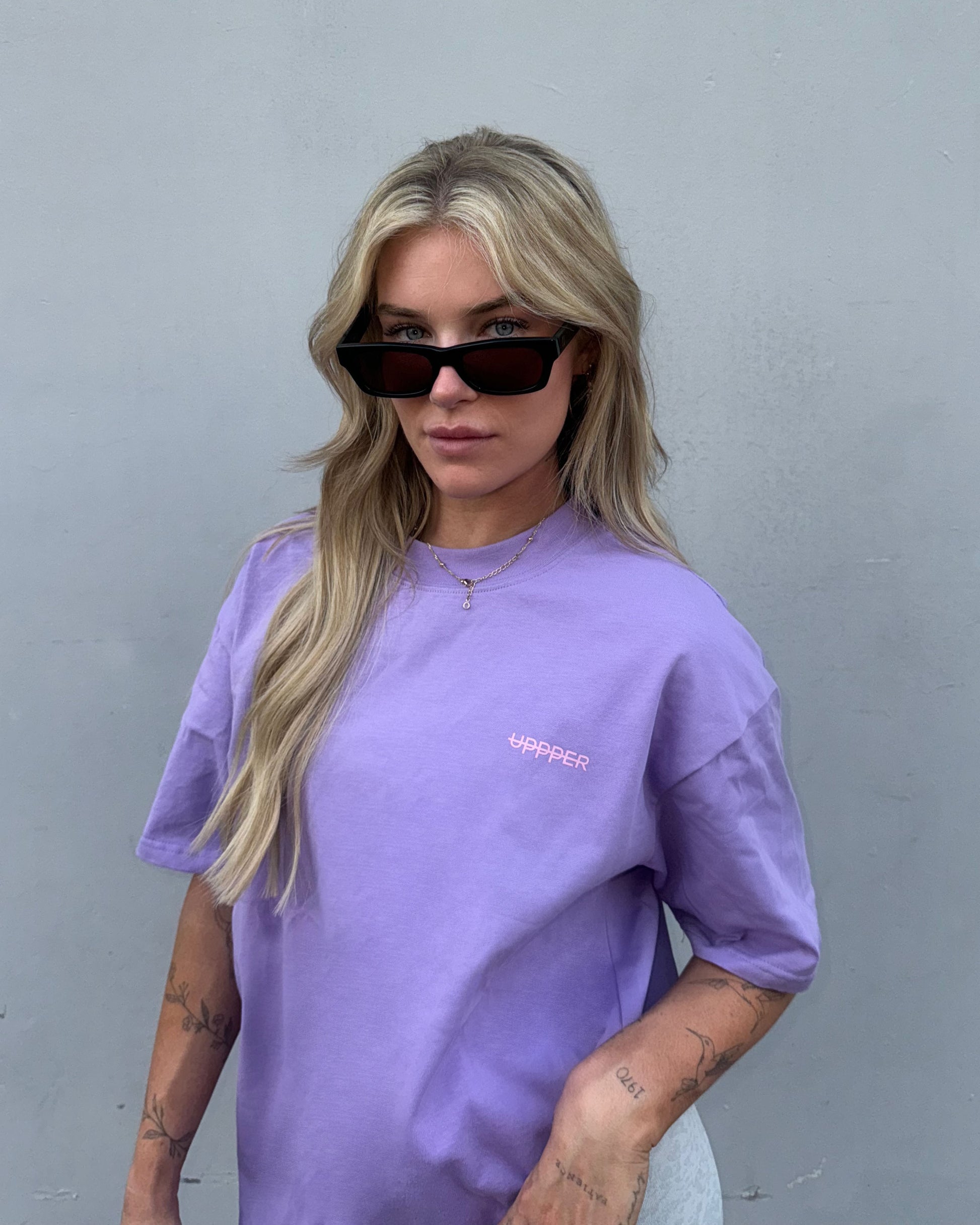 woman wearing lavender uppper core t-shirt outdoors