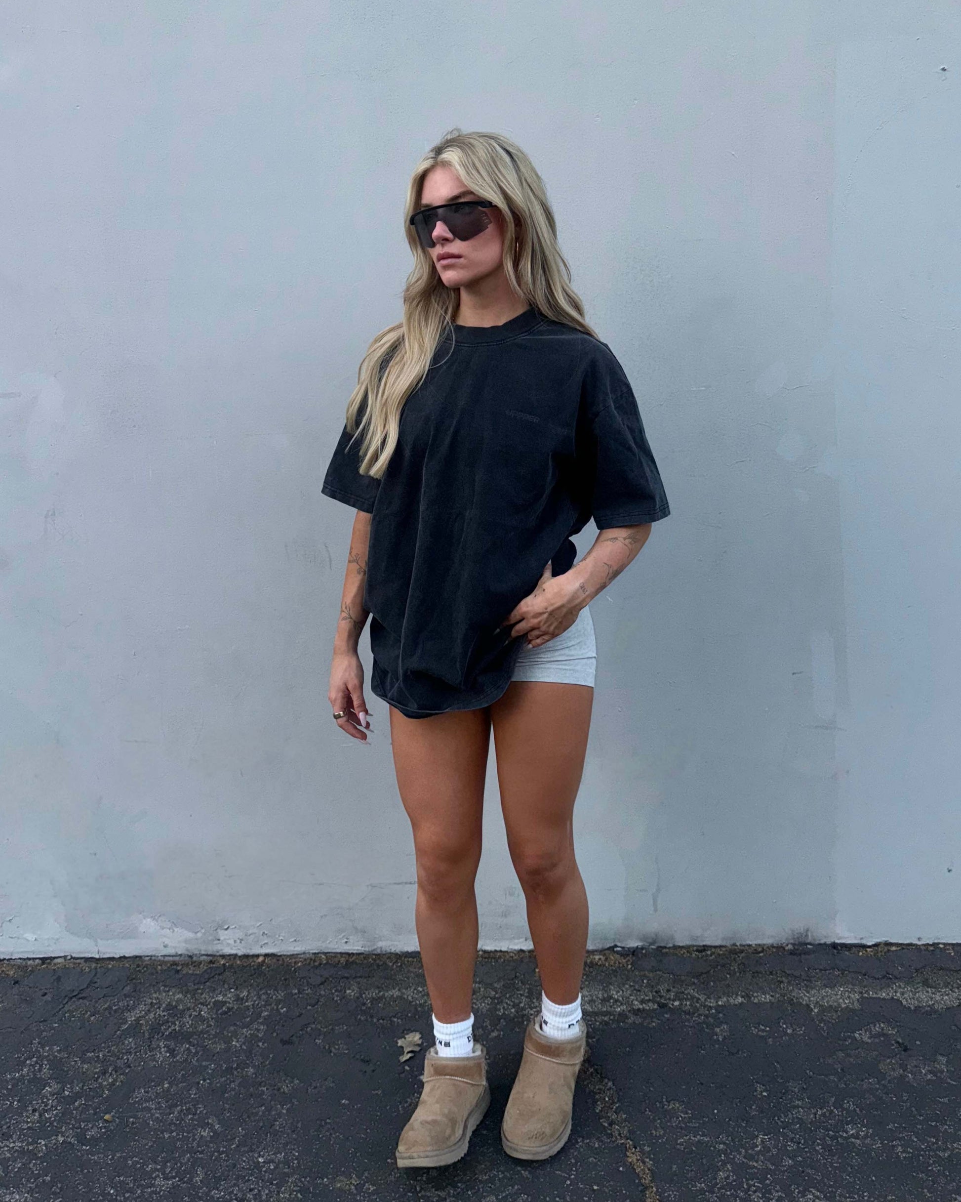 woman wearing washed black uppper ftn t-shirt outdoors