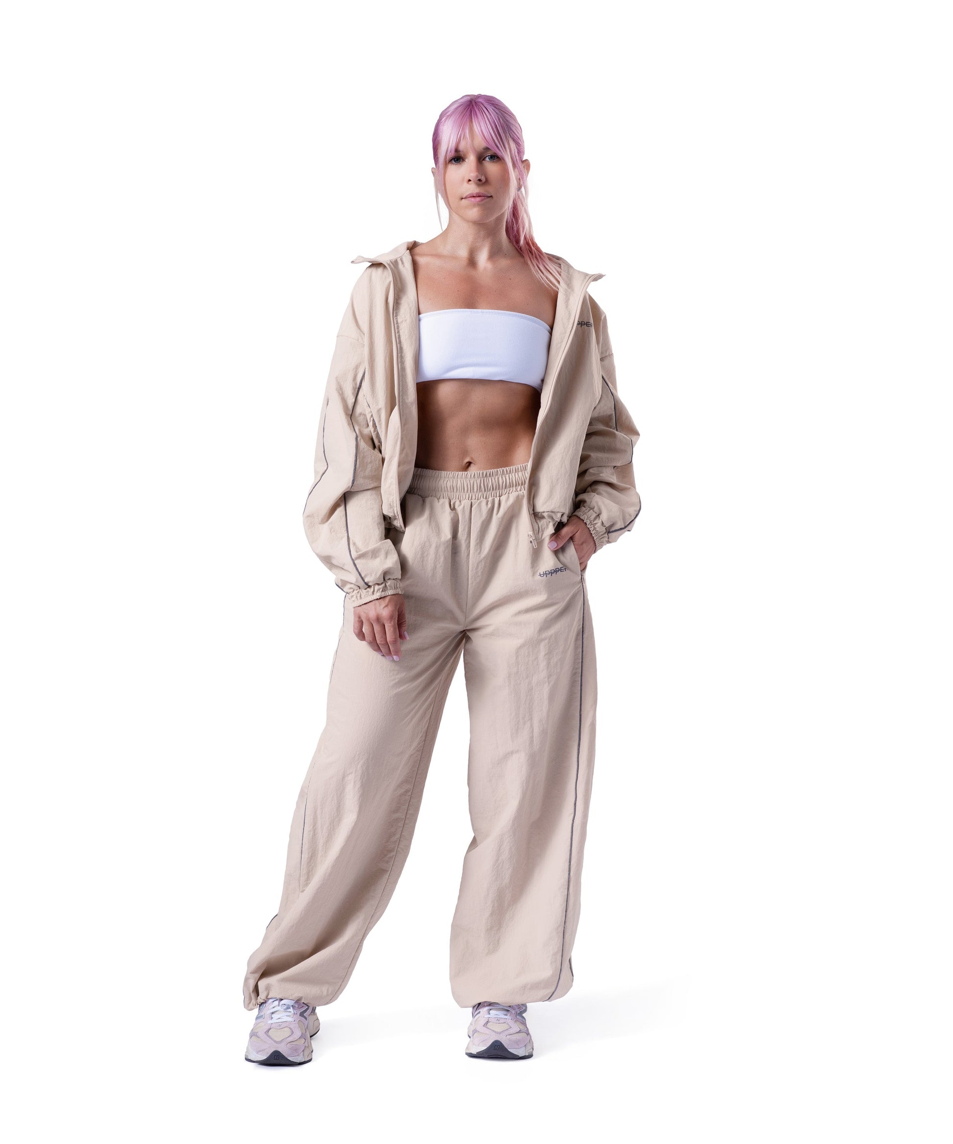 model wearing tan uppper track jacket lifestyle shot