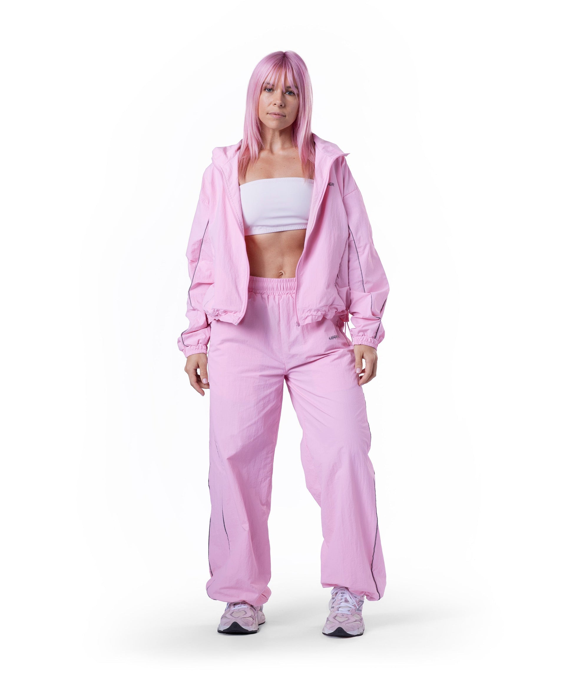 model wearing pink uppper track jacket lifestyle shot