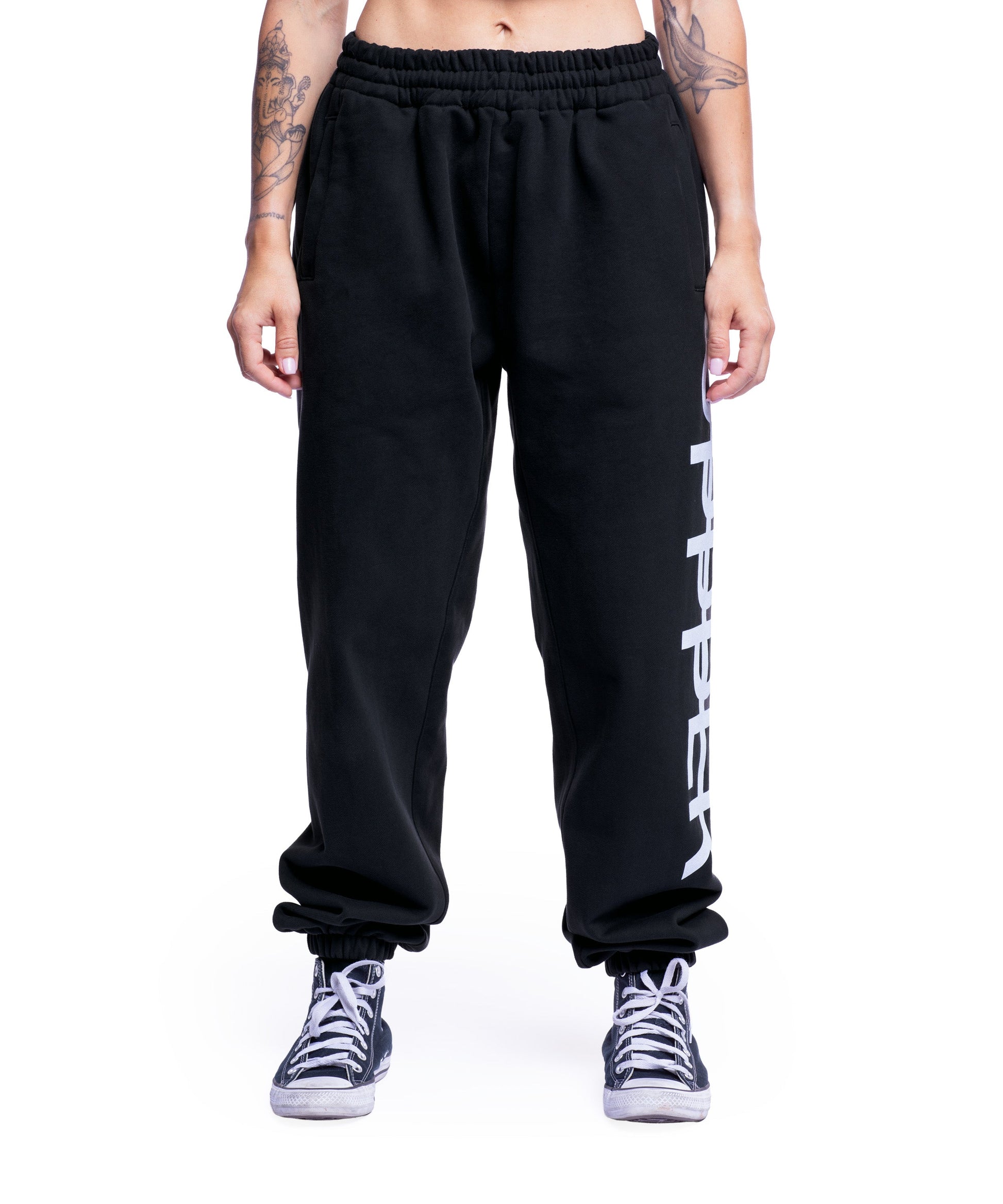 model wearing washed black uppper sweatpants womens showing full leg from waist down on white background