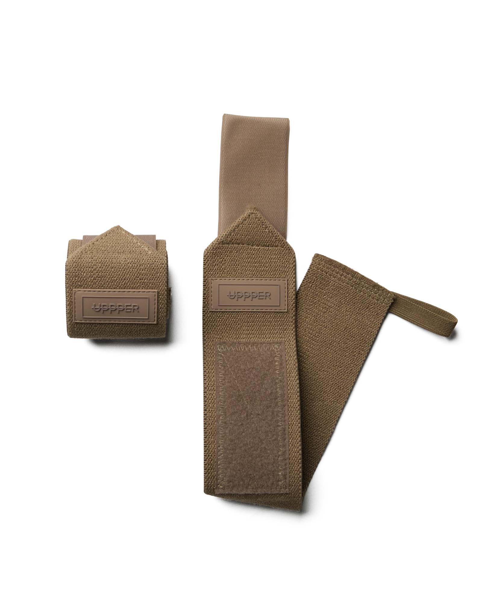 pair of mud uppper wrist wraps one rolled and one extended on white background