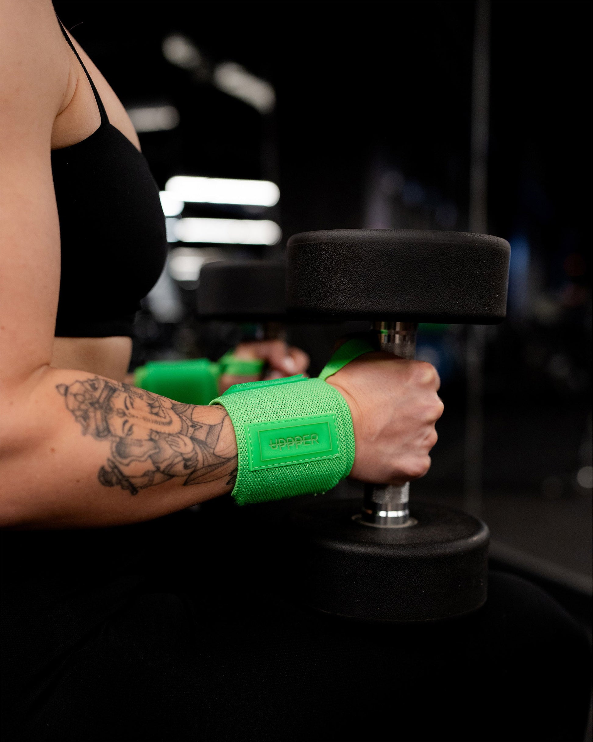 neon green uppper wrist wraps shown wrapped around wrist with velcro closure visible