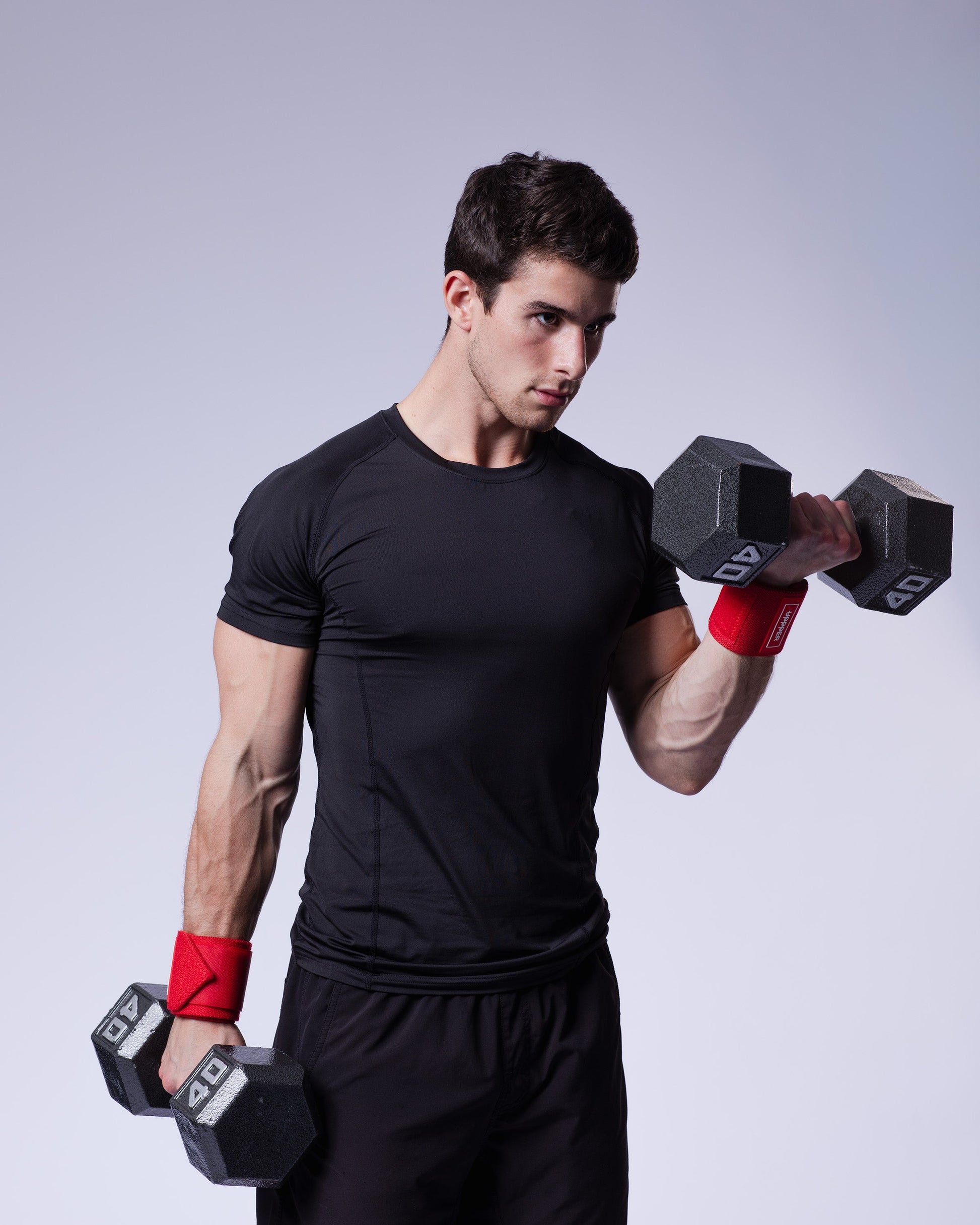 athlete performing exercise wearing red uppper wrist wraps 