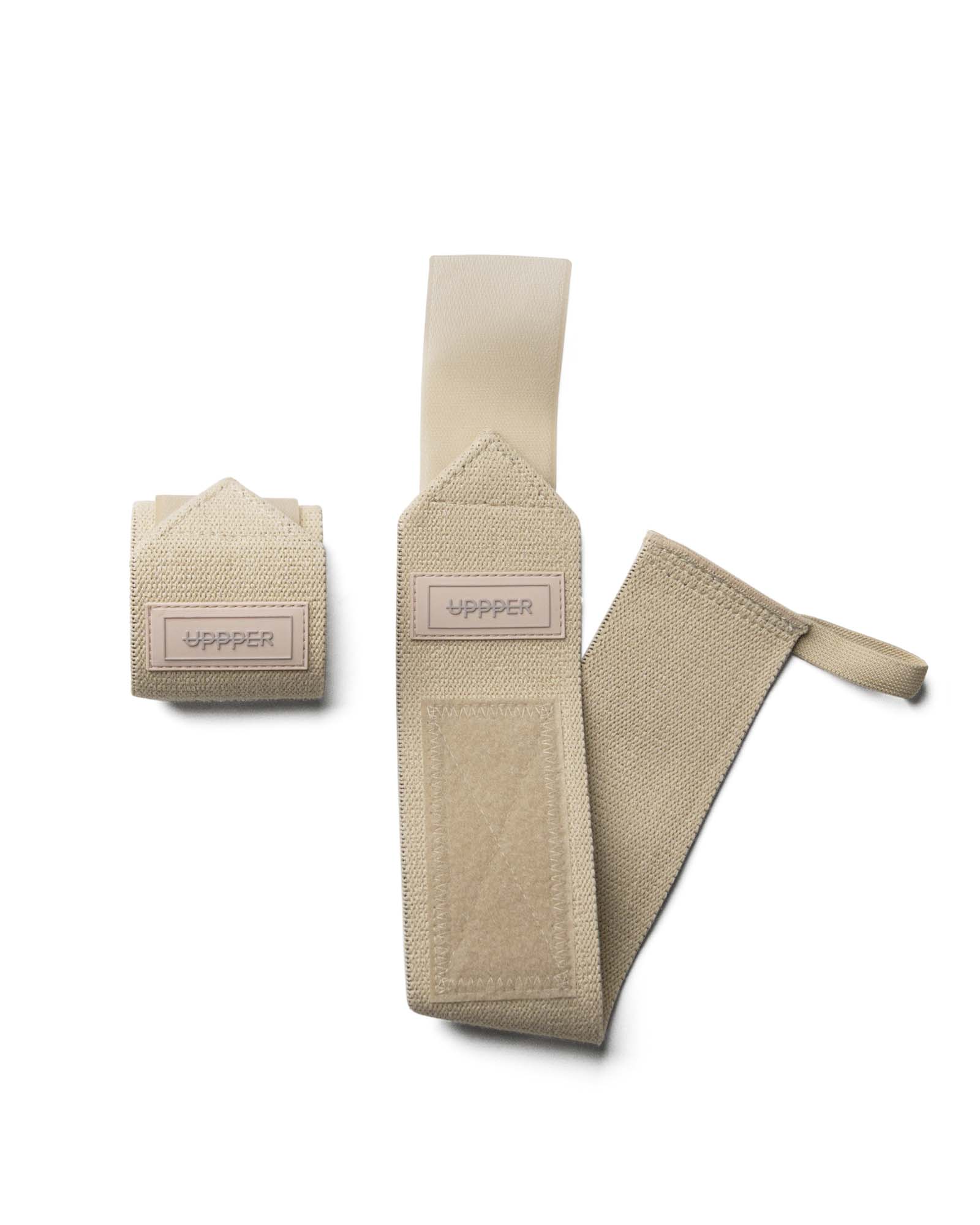 pair of sail uppper wrist wraps one rolled and one extended on white background