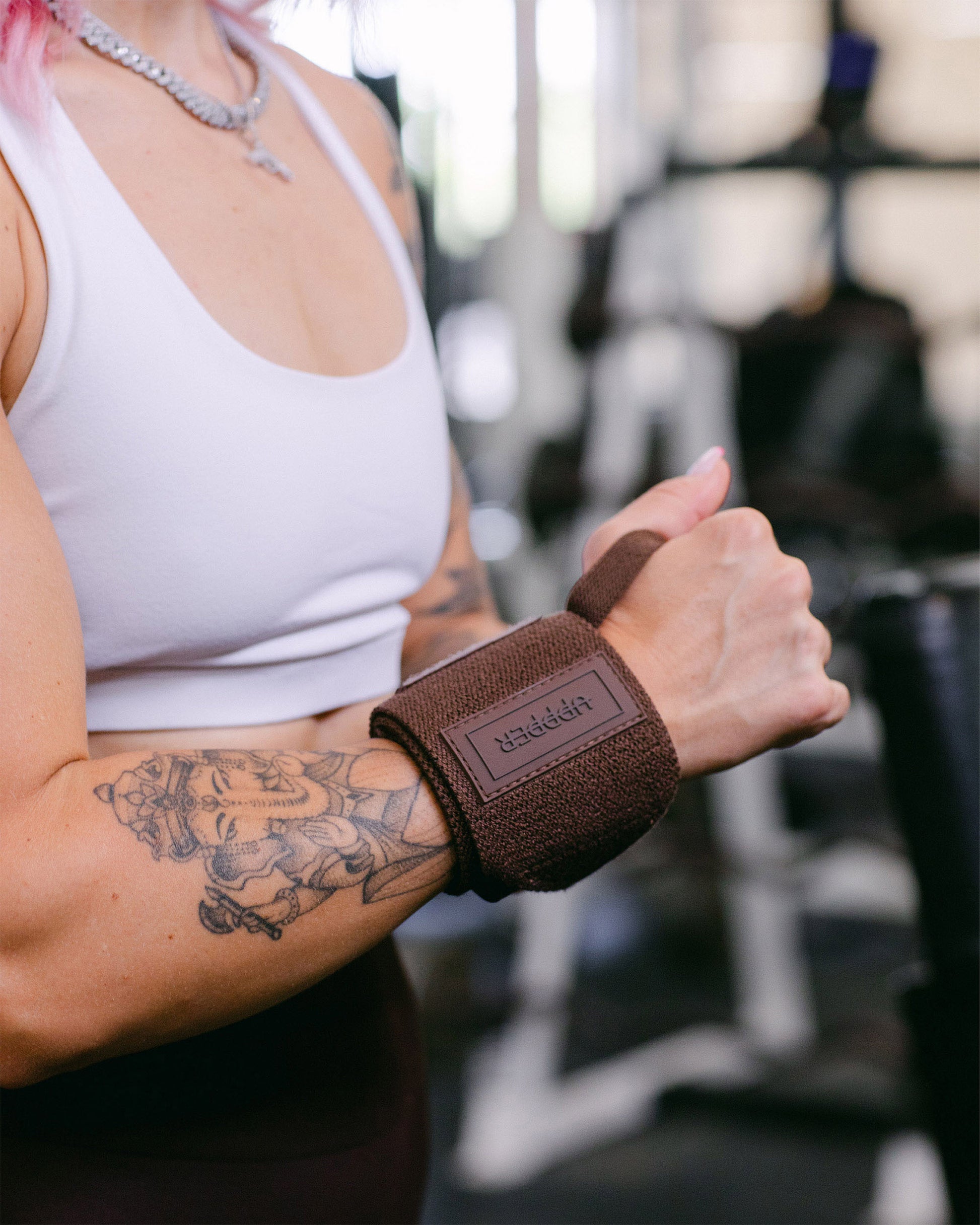 umber uppper wrist wraps shown wrapped around wrist with velcro closure visible