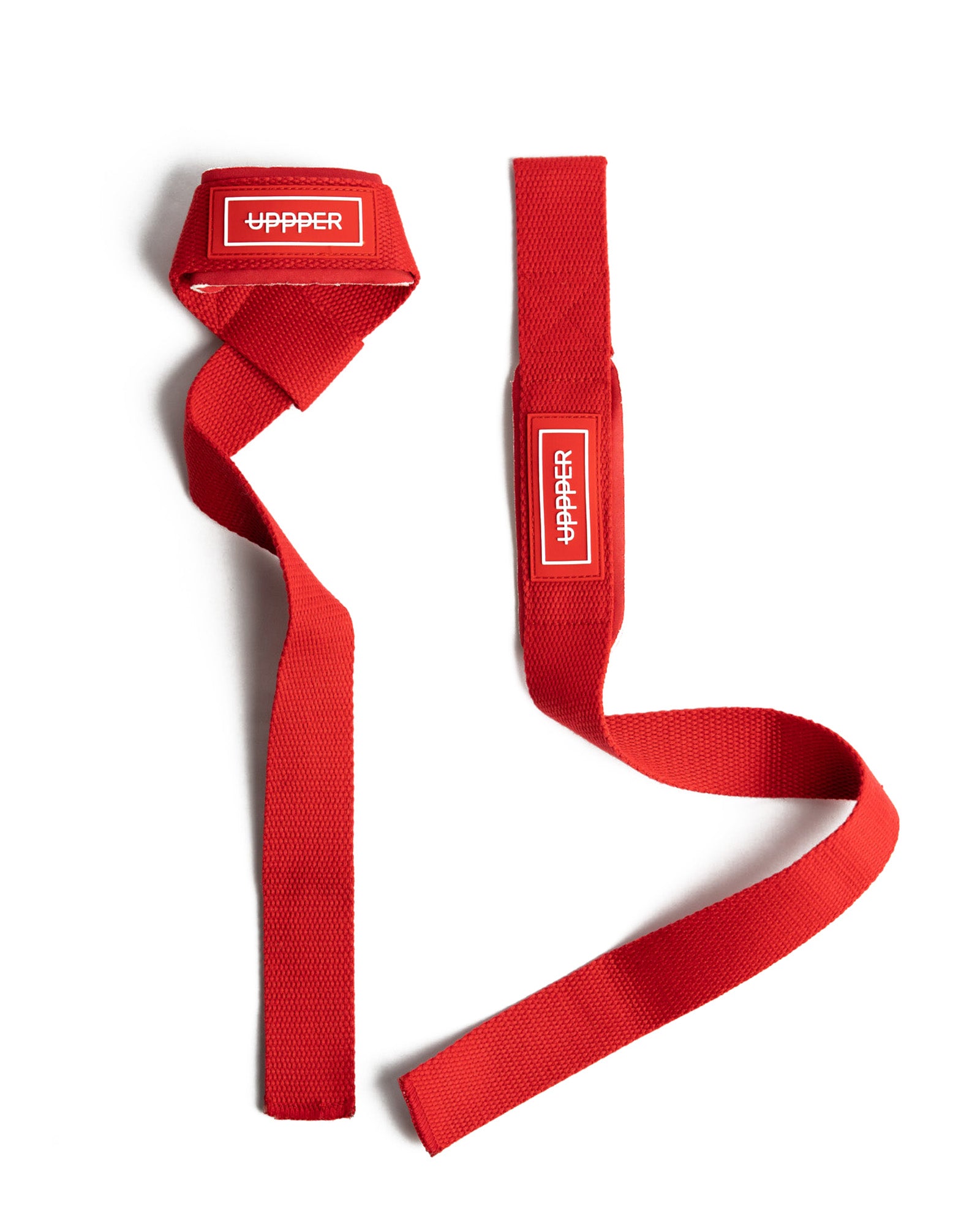 pair of red uppper lifting straps flat lay on white background
