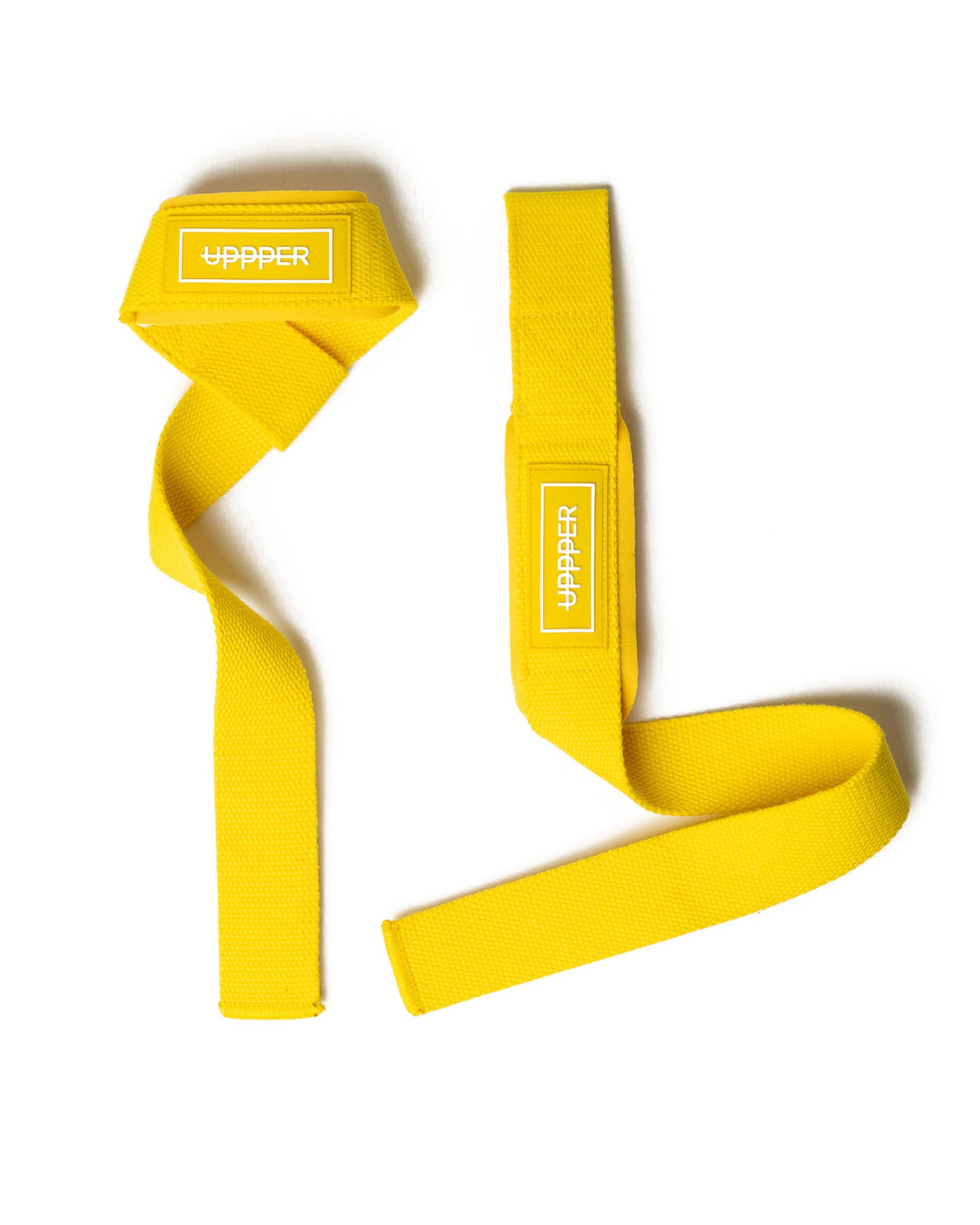 pair of yellow uppper lifting straps flat lay on white background