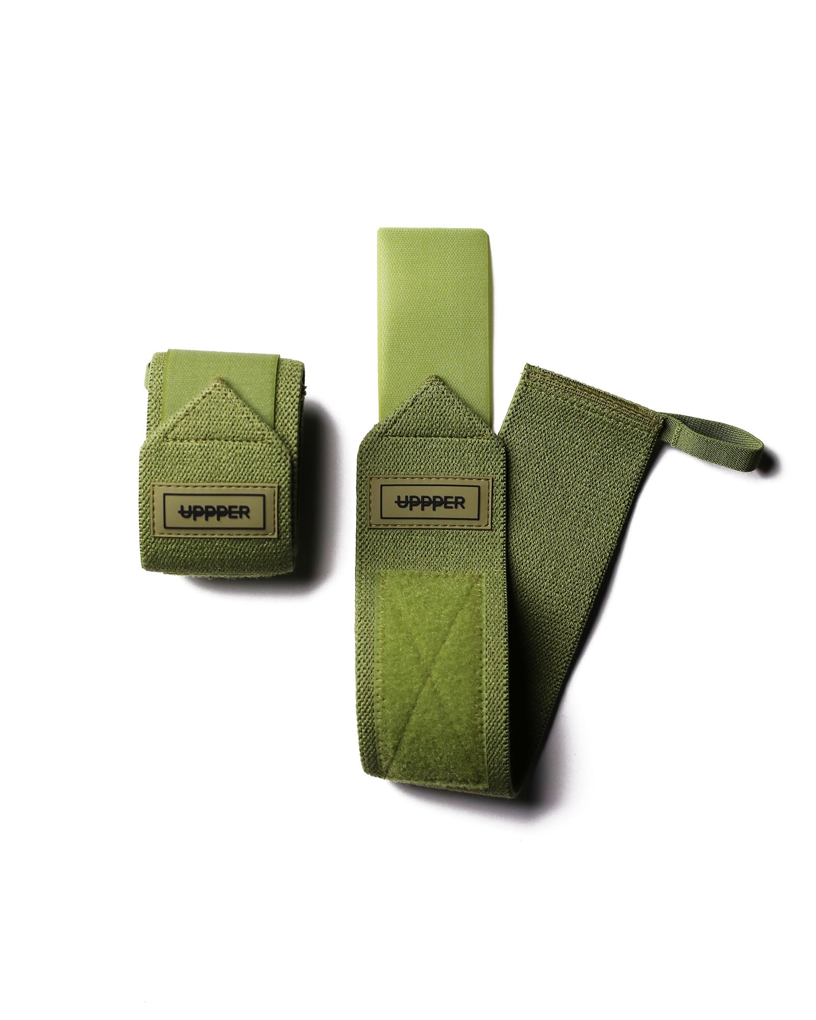 pair of khaki uppper wrist wraps one rolled and one extended on white background