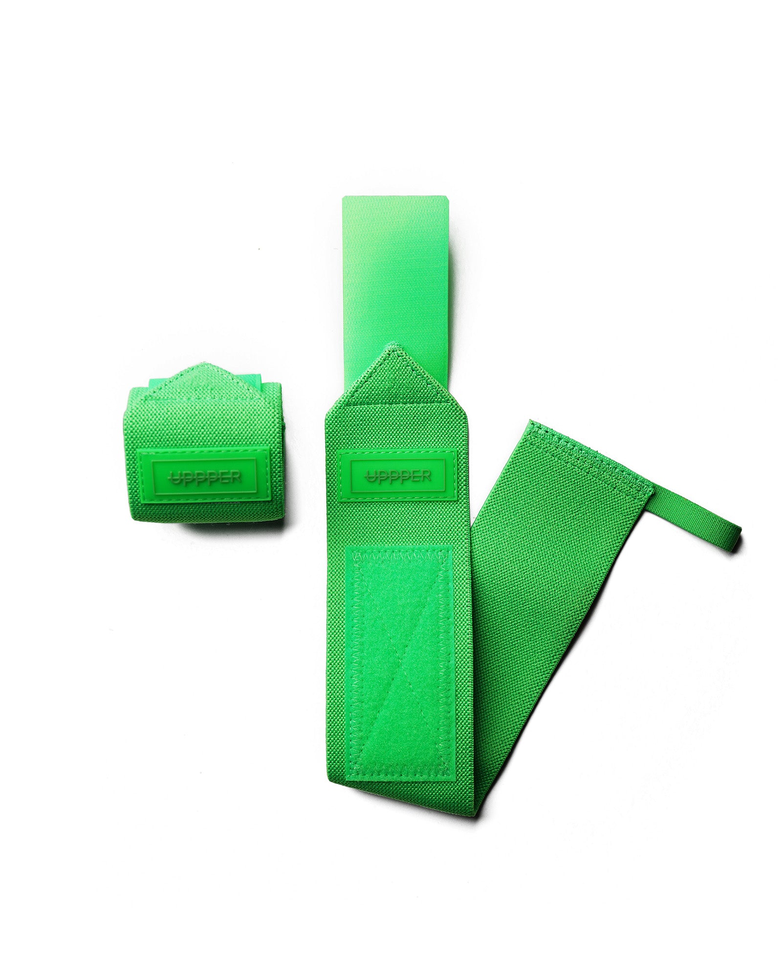 pair of neon green uppper wrist wraps one rolled and one extended on white background